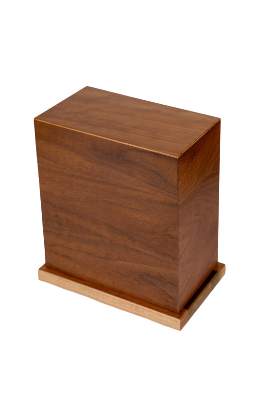 Handcrafted cremation urn made from American Black Walnut body and original spruce soundboard top reclaimed from a 1915 New York piano, 200 cubic inch capacity, angled view