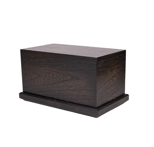 Handcrafted cremation urn made from 1910 American White Ash with satin black finish, reclaimed from New York piano, 80 cubic inch capacity, angled view