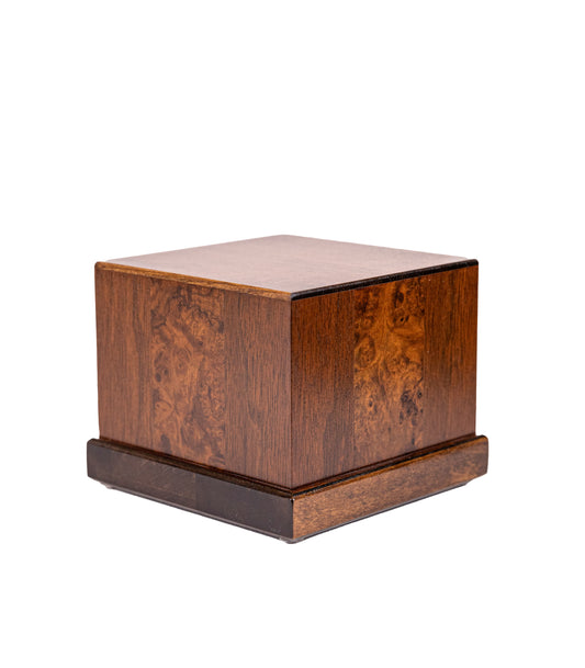 Angled view of 44 cubic inch handcrafted cremation urn made from 1920s Black Walnut with English Walnut Burl inlays from an 1885 piano and Sitka Spruce top from antique soundboard, finished in Early American Brown with Dark Walnut base