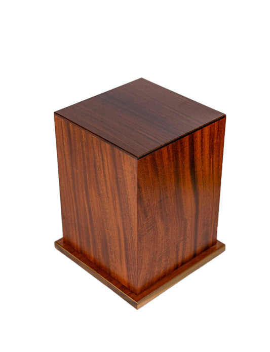 Angled view of 230 cubic inch handcrafted urn made from 1920 piano Cuban Mahogany, topped with Macassar Ebony and finished in natural satin