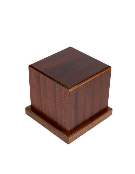 Angled view of 40 cubic inch keepsake urn with rare 1830 chestnut top, Cuban Mahogany sides, and American Oak base, handcrafted from antique pianos