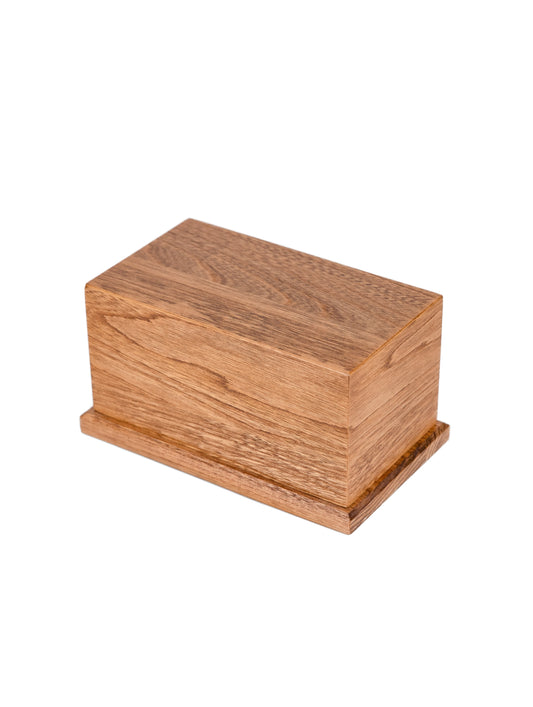 Angled view of 80 cubic inch urn made from 1910 New York piano White Ash, with Early American stain, ideal for keepsakes or shared ashes