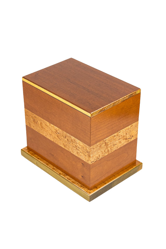 Handcrafted urn 145 cubic inch capacity made of American Black Cherry with Birdseye Black Walnut band and Cuban Mahogany top
