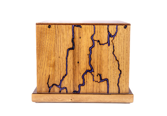 Closer front view of large 250 cubic inch urn with Lichtenberg burns, blue epoxy, walnut top, made from 1890 American piano oak wood