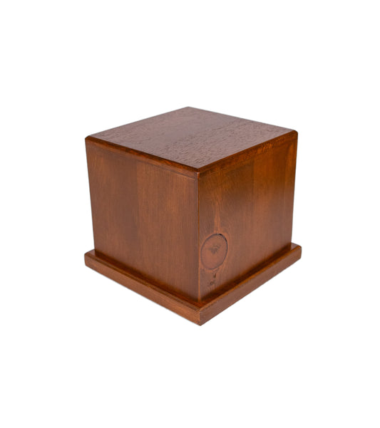 Angled view of handcrafted 100 cubic inch cremation urn made from 1901 American piano Pine wood with 1920s Cuban Mahogany top, finished in Canadian Maple brown with smooth, natural grain detailing — a historic and elegant keepsake urn for ashes
