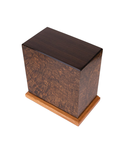 Handcrafted cremation urn with English Walnut Burl sides, Macassar Ebony top, and Cherry-Mahogany base, made from 1890 British piano wood, 200 cubic inch capacity, angled view