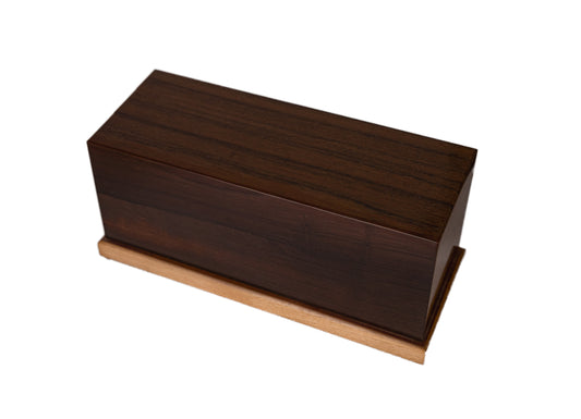 Handcrafted cremation urn made from 200-year-old American Chestnut with Honduran Mahogany top and Red Oak base, 200 cubic inch capacity, angled view